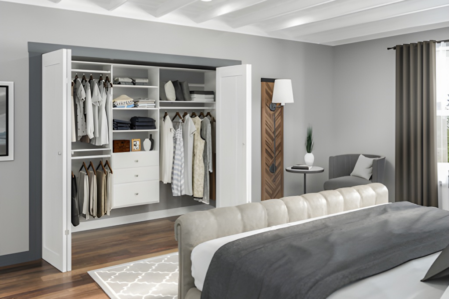 Bedroom with an open, organized closet featuring hanging clothes, shelves, and folded items.