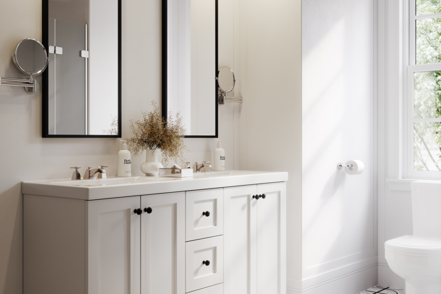 Elegant white bathroom vanity with double sinks, black-framed mirrors, and natural light from a nearby window.