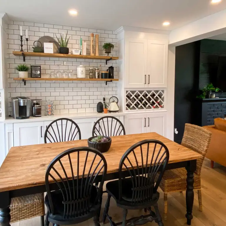 Rustic dining room with wooden table and open shelving.