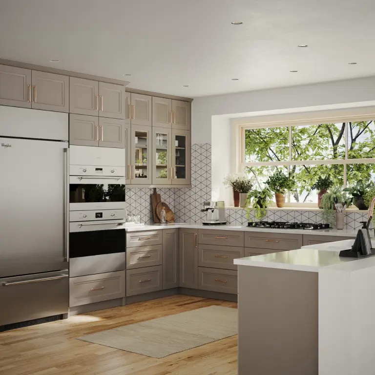 Spacious modern kitchen featuring taupe cabinets, large windows, stainless steel appliances, and a bright, plant-filled window view.